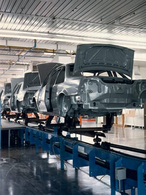 Inverted paint conveyor for automotive application