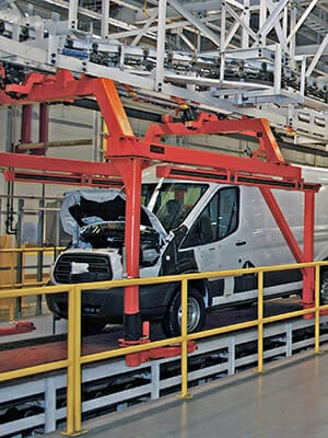 overhead conveyor to deck on flattop for automotive application